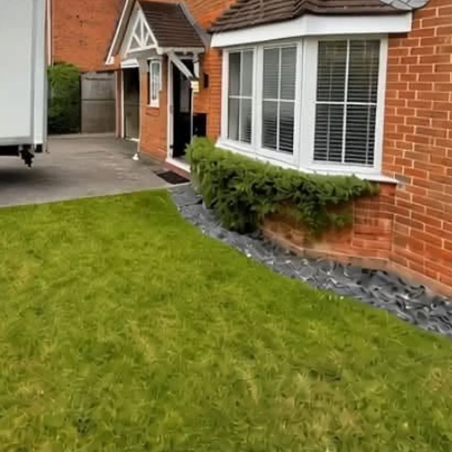 Surrey Prestige Removals van parked on the driveway of a detached house